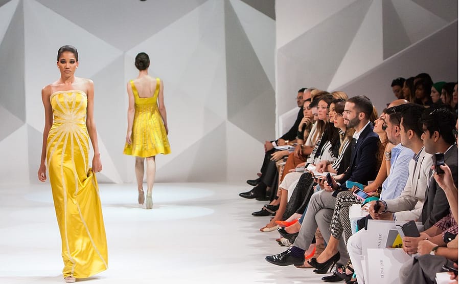 fashion model on yellow dress on a fashion show